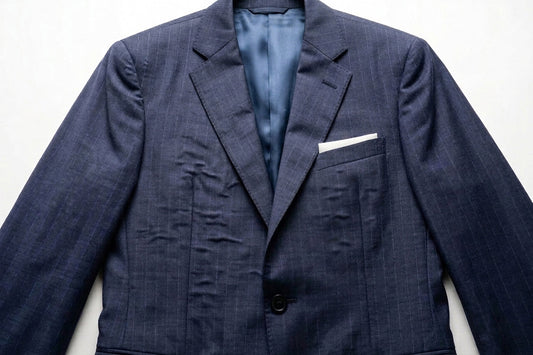 Why Does a Suit Become Bubbly After Getting Wet in the Rain?